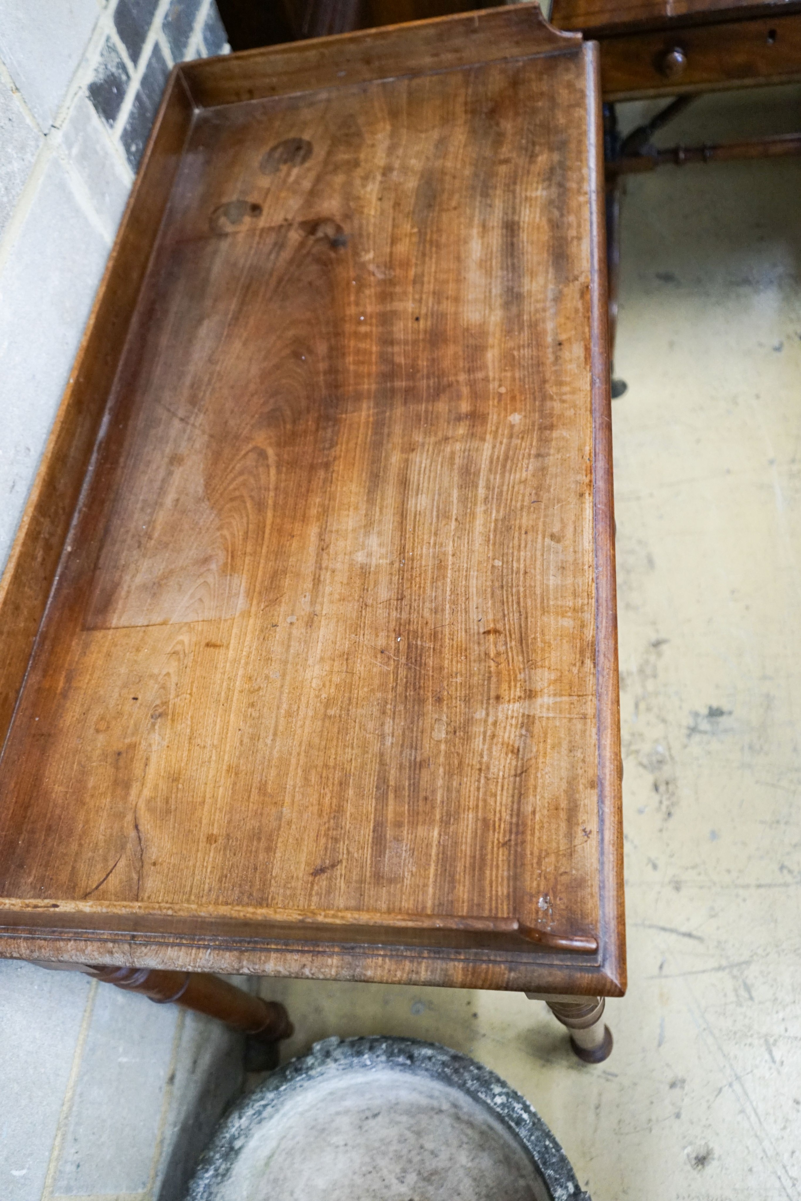 A Victorian mahogany two drawer side table stamped 